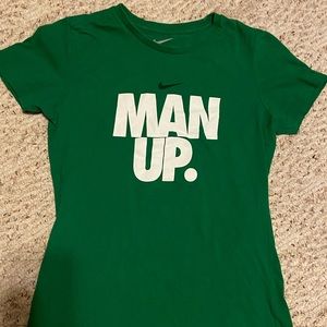 Green nike t-shirt.